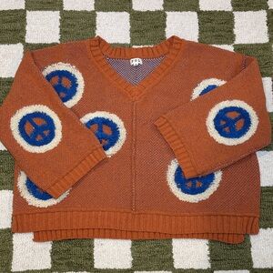 Three Bird Nest Boutique Peace Sign Oversize V-neck Sweater